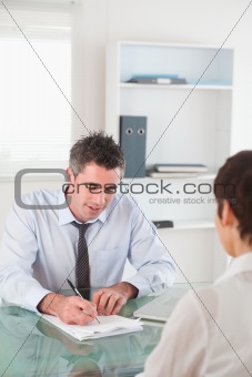 Portrait of a manager interviewing a female applicant