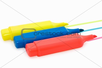 three markers on white background