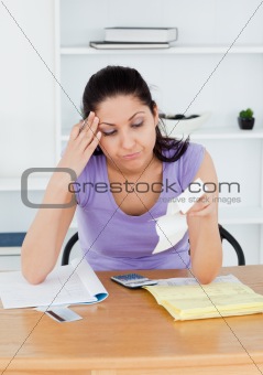 Frustrated young female accounting