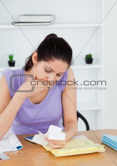 Shocked young woman accounting
