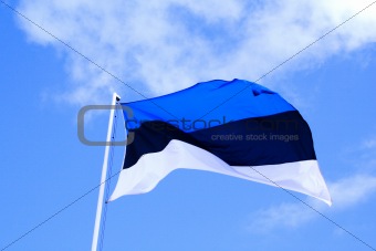 Flag of Estonia waves in sky