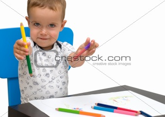 Little boy and pencils