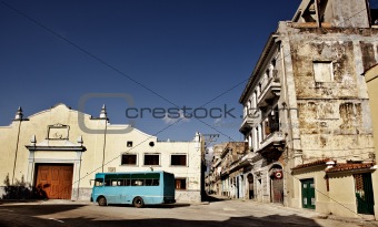 Blue bus on an empty square