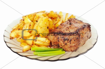 Grilled meat and  fried  potatoes  on a plate