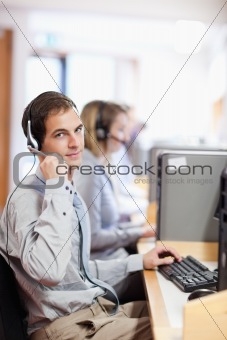 Portrait of a customer assistant using a headset