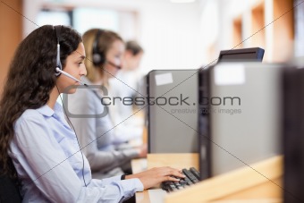 Customer assistant working with a computer