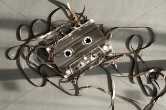 Audio tape cassette with subtracted out tape. 