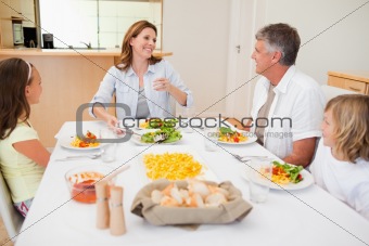Cheerful family at the dinner table