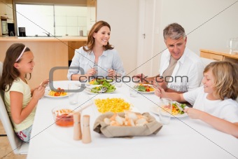 Family having a conversation while dinner
