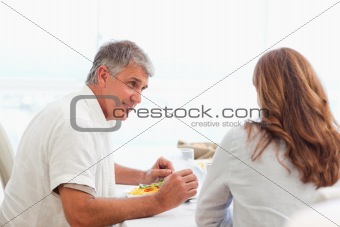 Couple talking during dinner
