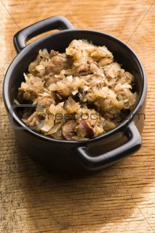 traditional polish sauerkraut (bigos) with mushrooms and plums for christmas 