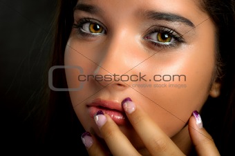 Young model touching her face with her fingers
