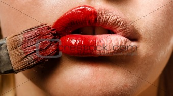 Conceptual photo of a makeup and the lips of a girl