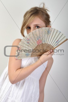 beautiful girl hiding behind a fan