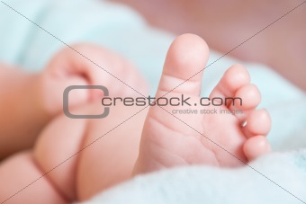 baby's foot on blanket