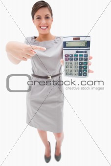 Woman pointing at hand calculator