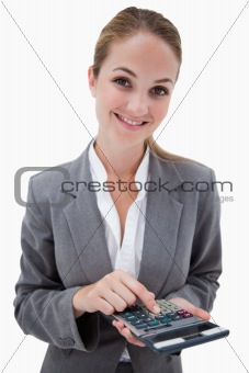 Smiling bank employee with pocket calculator