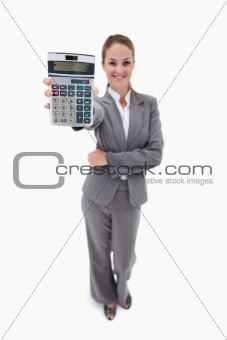 Smiling bank employee showing pocket calculator
