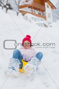 The girl goes for a drive on an snow slope.
