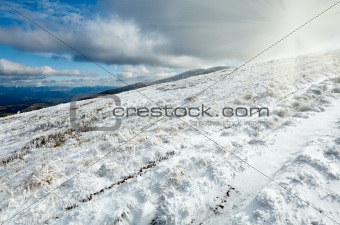First winter snow on autumn  mountain plateau