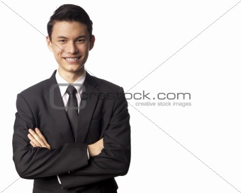 Young Asian Corporate Man Folding his Arms Over White Background