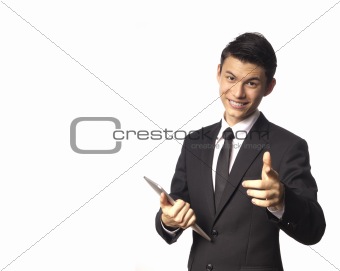 Young Asian Corporate Man with Tablet PC Pointing towards the Front over White Background