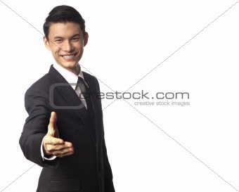 Young Asian Corporate Man Offering a Hand Shake Over White Background