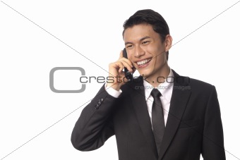 Young Asian Corporate Man Talking on the Phone Over White Background