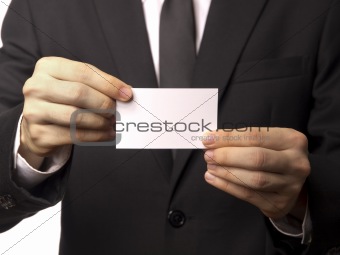 Corporate Man in Black Suit Displaying a White Card