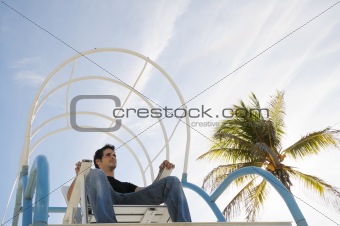 Boy sitting in beach chair