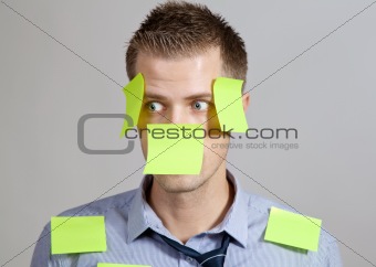 Businessman with post in notes