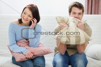 Young man frustrated of girlfriends long phone talking