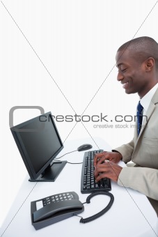 Side view of a businessman using a computer