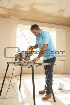 Builder Using Electric Saw