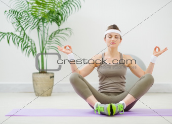 Healthy young woman meditating