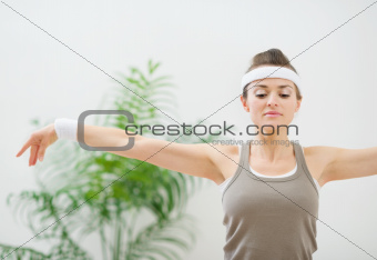 Fitness woman making gymnastics