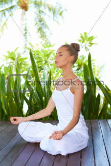 Woman in lotus position meditating
