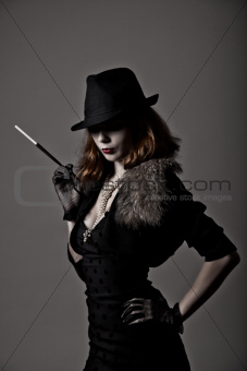Retro shot of gangster woman in fedora hat 