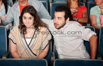 Guy Flirting in Theater