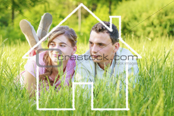 Young couple dreaming to a house