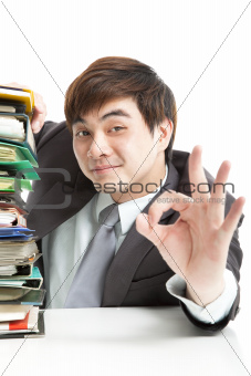 smart businessman with ok gesture in the office