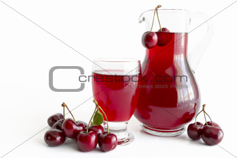 Cherry juice in glass and carafe