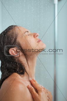 Portrait of woman bathing in shower