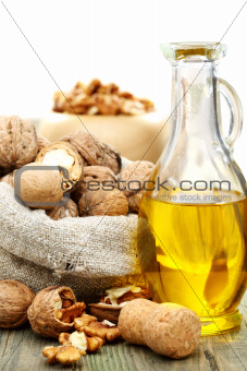 Walnut oil  and nuts in a bag.