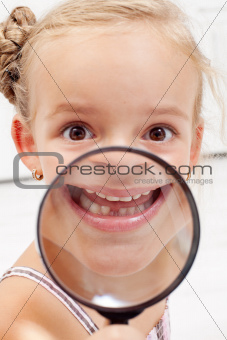 Little girl showing missing teeth
