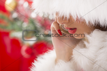 Gorgeous Santa girl speaking at phone.