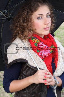 Beautiful curly hair woman with an umbrella