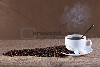 Cup of fresh and hot steaming coffee