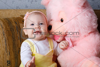 small girl and toy bear