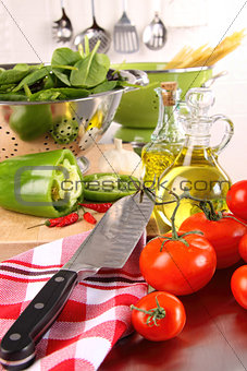 Fresh tomatoes and green peppersl on counter